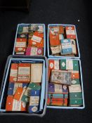 Four crates containing vintage books including a large collection of Penguin and Pelican books