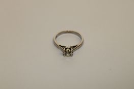 An 18ct white gold diamond solitaire ring,