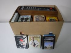 A box containing a Sharp solid state 8 track player and a quantity of 8 tracks