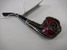 A twentieth century pipe with filigree metal work decoration