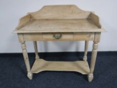 A Victorian stripped pine washstand fitted a drawer