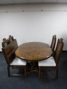 A colonial style extending dining table with leaf together with four chairs