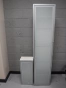 Two Ikea glass door bathroom cabinets