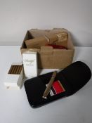 A box containing smoking related pieces including cigars, cigarillos, 9ct gold mounted cheroot,