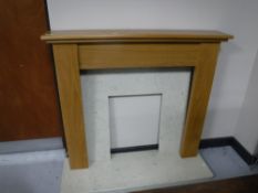 A contemporary oak fire surround,
