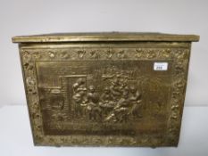 An embossed brass coal box