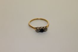 An 18ct gold sapphire and diamond ring