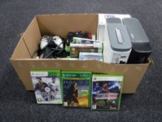 A box containing two Xbox 360's, together with a boxed Xbox 360 HD DVD player, assorted games,