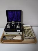 A tray containing boxed table cutlery,