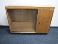 An oak glass door bookcase fitted a cupboard