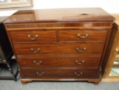 A Victorian inlaid mahogany chest of five drawers on ogee bracket feet,