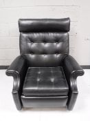 A mid 20th century black button vinyl reclining chair