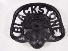A cast metal Blackstone tractor seat