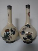 A pair of Japanese cloisonne vases with flower and bird decoration,