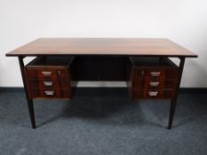 A mid 20th century twin pedestal desk