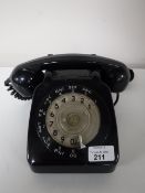 A black Bakelite cased telephone