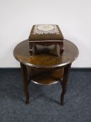 A circular oak two tier occasional table together with a tapestry upholstered footstool