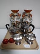 A tray containing a four piece Ashberry plated tea service,