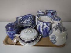 A tray containing blue and white willow pattern china, Ringtons caddies and ginger jars,