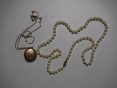 A nine carat gold locket and chain,