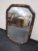 An early 20th century mahogany and gilt framed bevel edged mirror