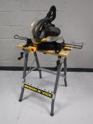 A Pro 210 MM sliding compound mitre saw on work bench
