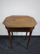 A late 19th century inlaid mahogany work table on tapered legs