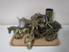 A tray containing brass horse and cart, brass crucifix, brass tea pot, ammunition shell,