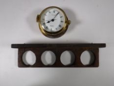 A brass cased Vetus quartz ship style clock,