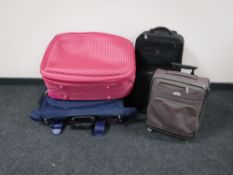 A quantity of assorted luggage cases together with a luggage trolley