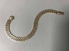 A three-tone 9ct gold bracelet, 11.6g.