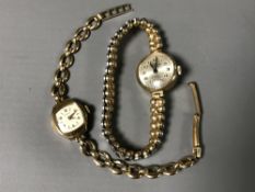 Two 9ct gold lady's watches - one on expansion bracelet and one by Rotary with metal core integral
