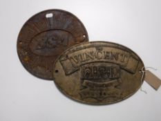 Two cast metal plaques;