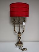 A contemporary gilt two way table lamp with shade