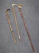 A horn handled walking stick and two others