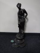 A garden water feature of a maiden