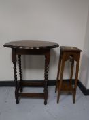 A carved oak plant stand and an oak occasional table