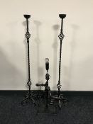 Two cast iron candle holders and a hand drill table lamp