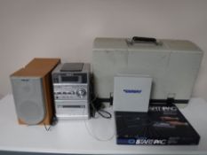 A cased vintage Osbourne computer together with a boxed starter pack and a Sony micro hifi system