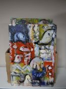 A box containing a large quantity of unframed oils on boards and canvases