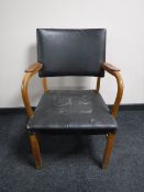 A mid 20th century oak office armchair