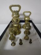 A group of nine 19th century graduated brass weights