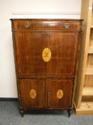 A nineteenth century inlaid mahogany secretaire chest with fitted interior,