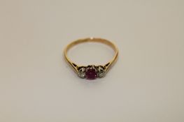 An 18ct gold ruby and diamond ring
