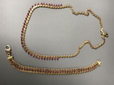A 14ct gold ruby set necklace and bracelet, 21.5g.