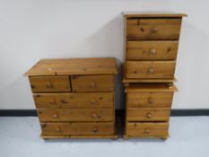 A pine five drawer chest and a pair of bedside chests