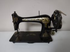A vintage mid 20th century Singer hand sewing machine