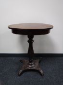 An early 20th century mahogany pedestal occasional table fitted a drawer