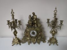 A three piece French brass clock garniture