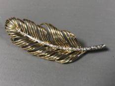 An 18ct gold diamond set leaf brooch, 7.6g.